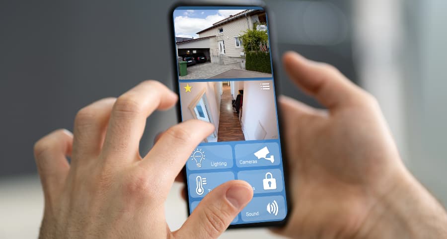 Resident examining surveillance camera footage on a mobile device